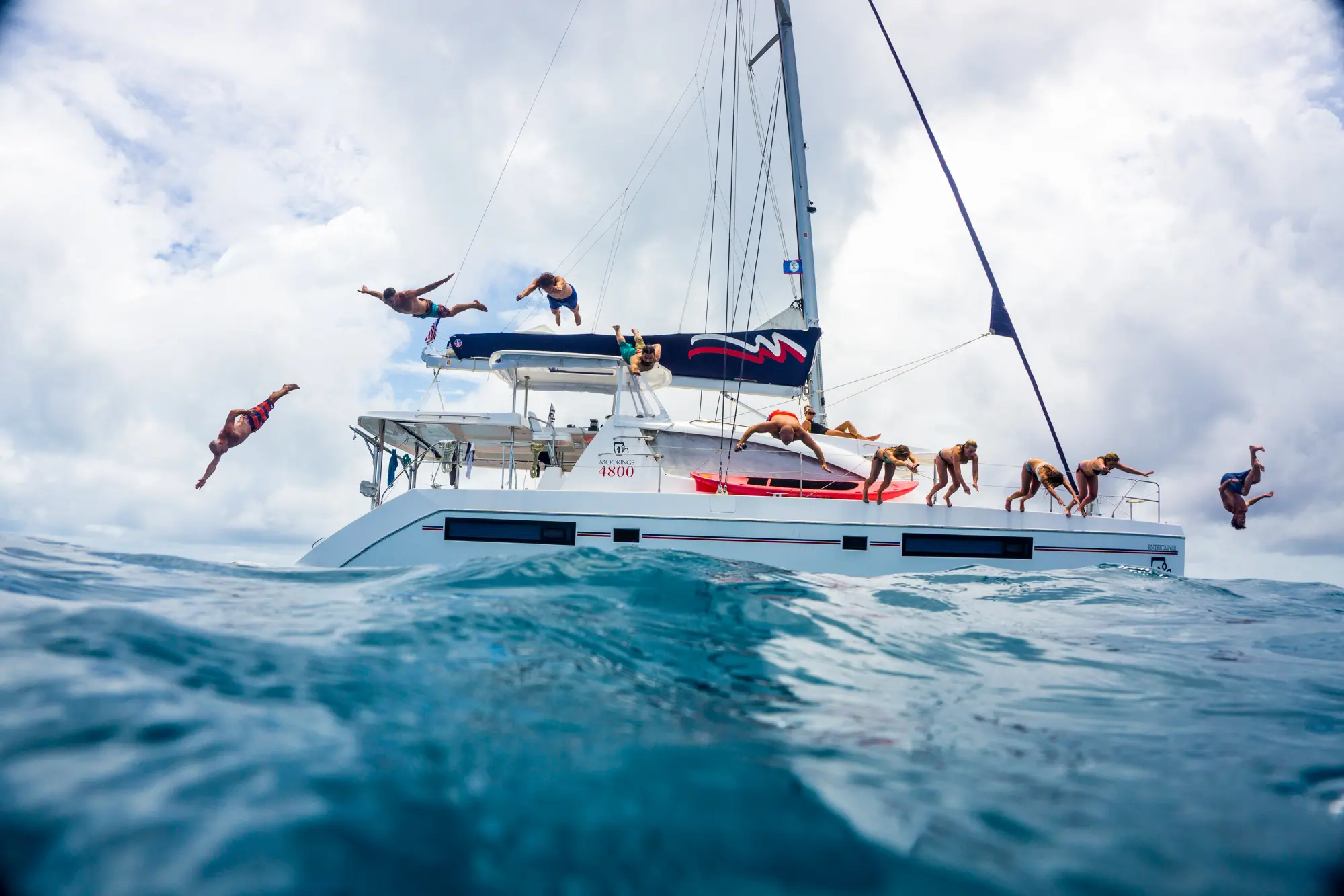 Group of happy sailors on a yacht